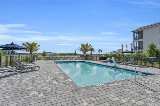 a view of house with yard and outdoor seating