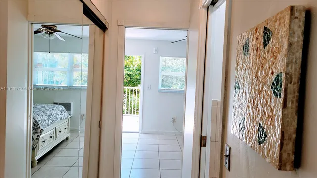 a view of walk in closet with wooden floor