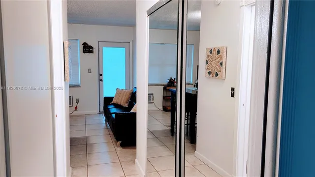 a hallway with view of living room