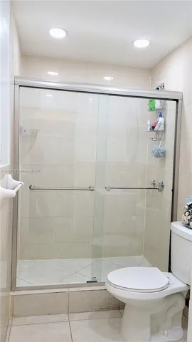 a view of parking garage with cars and parked