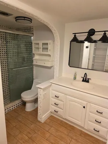 a kitchen with cabinets appliances and a counter space