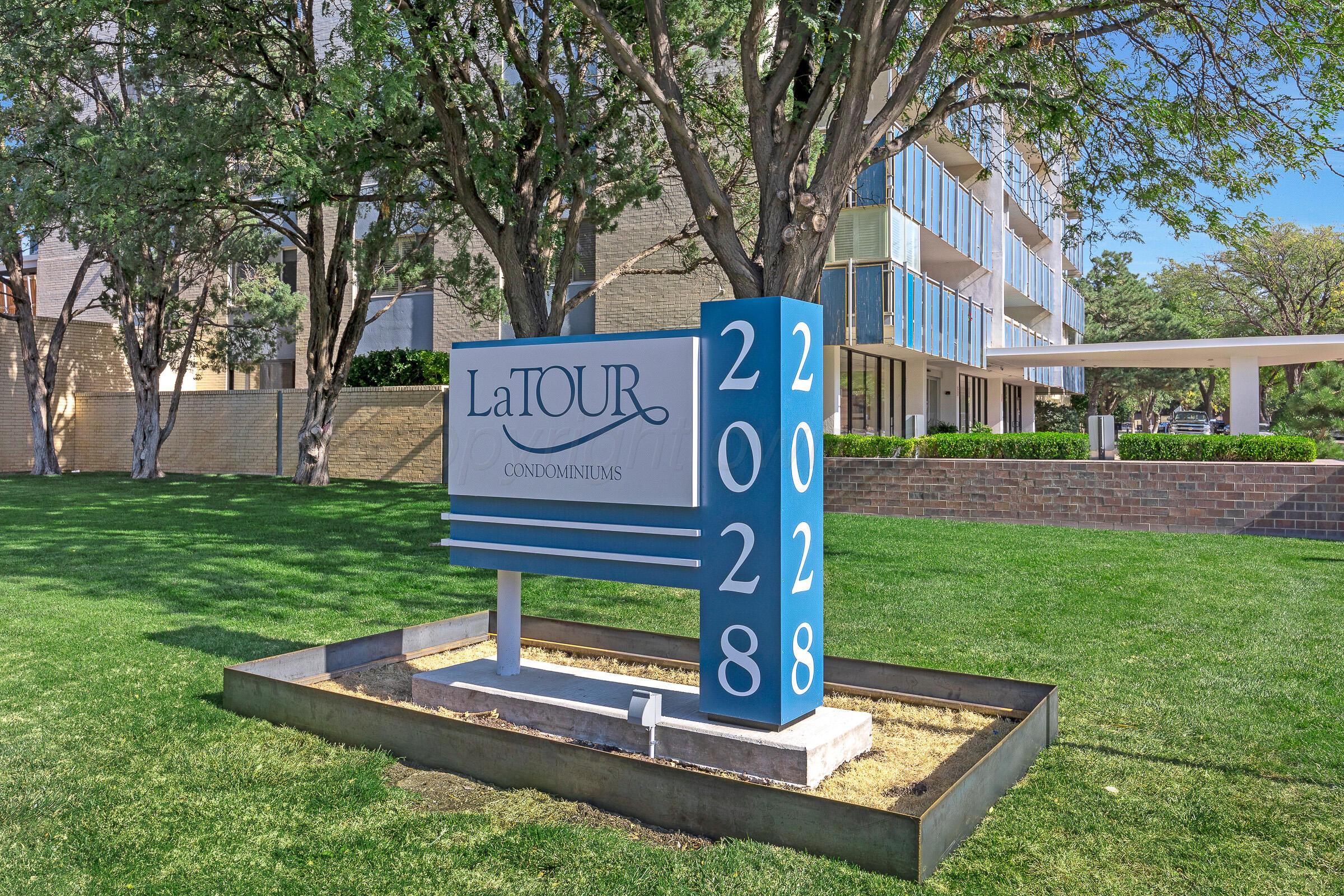 2028 South Austin Street, Unit 1104 Amarillo, TX 79109 - Photo 2 of 37 a sign on the side of the grass