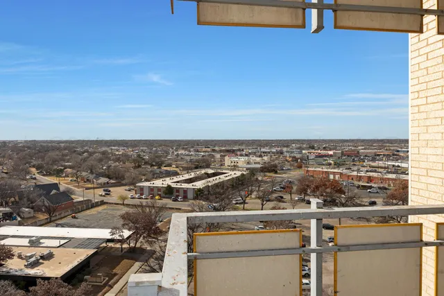 an aerial view of residential building and trees
