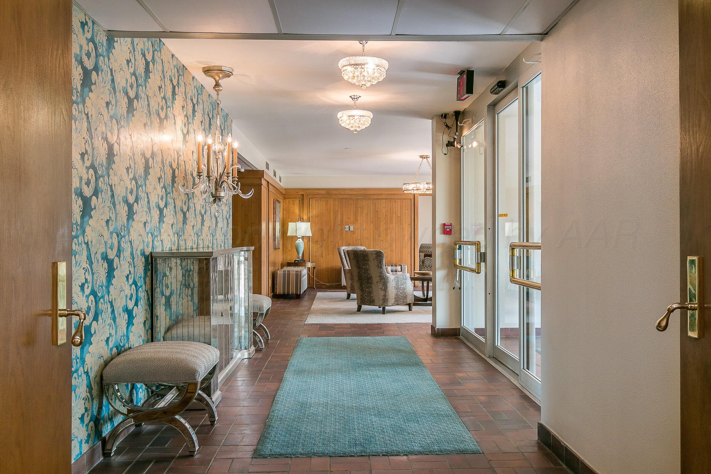 2028 South Austin Street, Unit 1104 Amarillo, TX 79109 - Photo 30 of 37 a living room with furniture and a fireplace