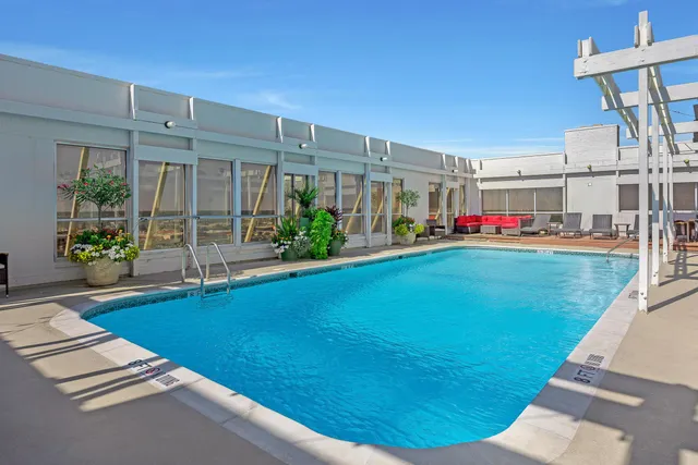 a living room with furniture and garden view