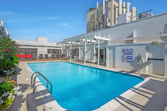 a view of swimming pool with outdoor seating