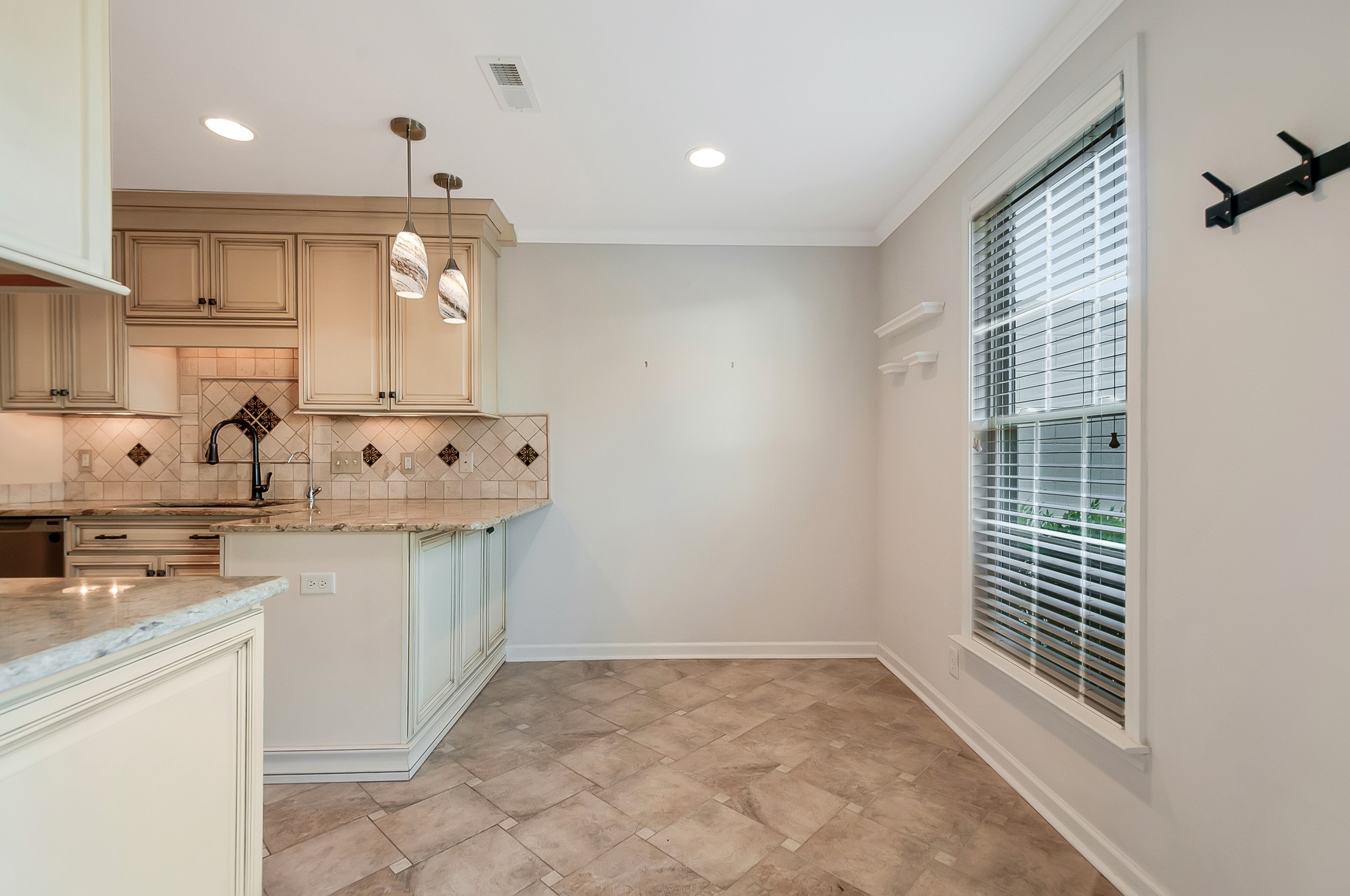 1078 General George Patton Road Nashville, TN 37221 - Photo 14 of 33 a kitchen with granite countertop a sink stainless steel appliances and cabinets
