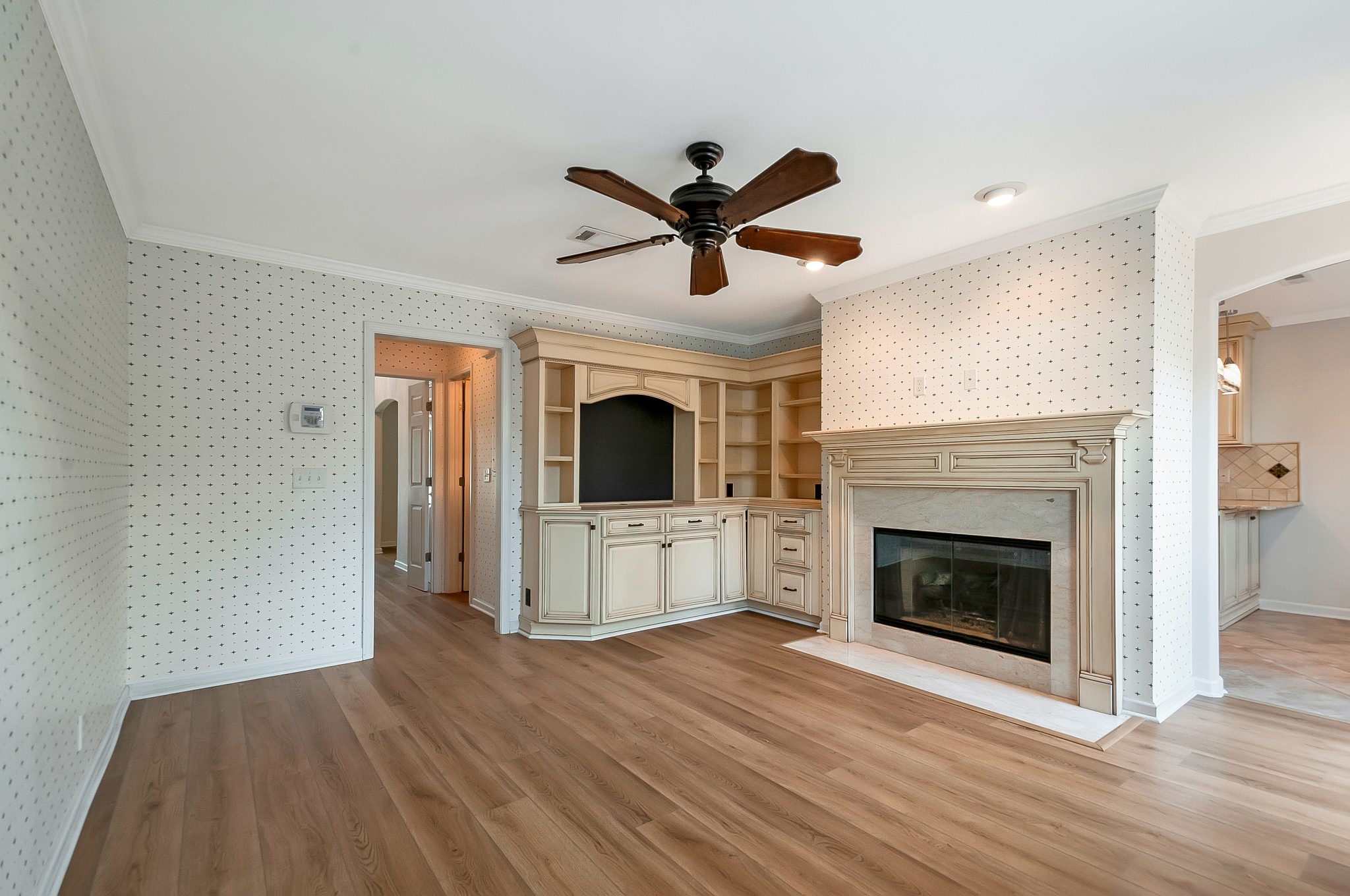 1078 General George Patton Road Nashville, TN 37221 - Photo 16 of 33 a view of a livingroom with a fireplace and a ceiling fan