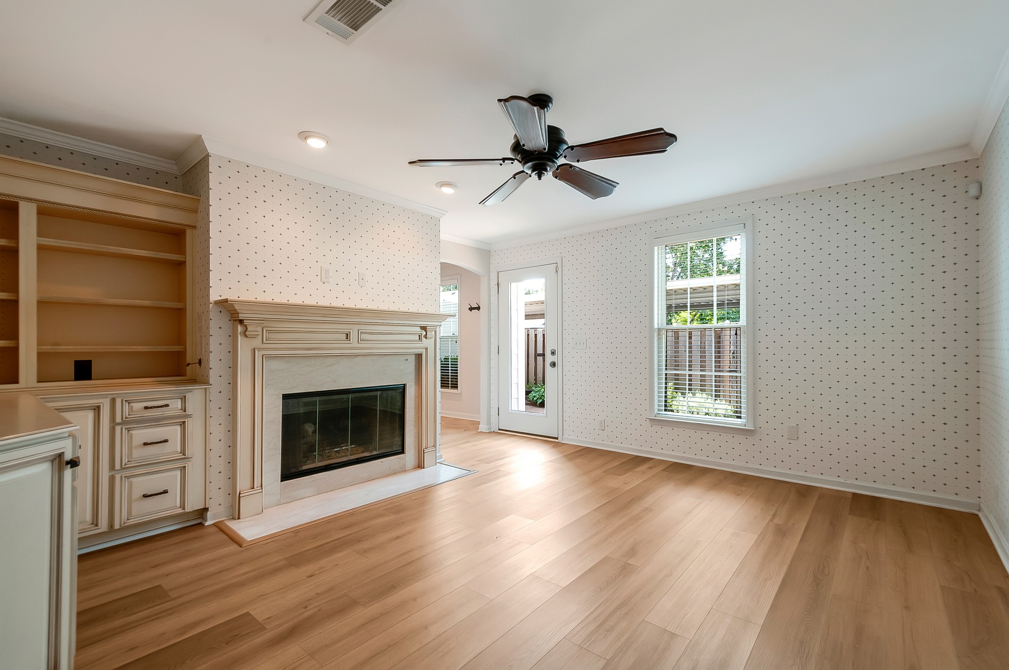 1078 General George Patton Road Nashville, TN 37221 - Photo 18 of 33 a view of an empty room with a fireplace and a window
