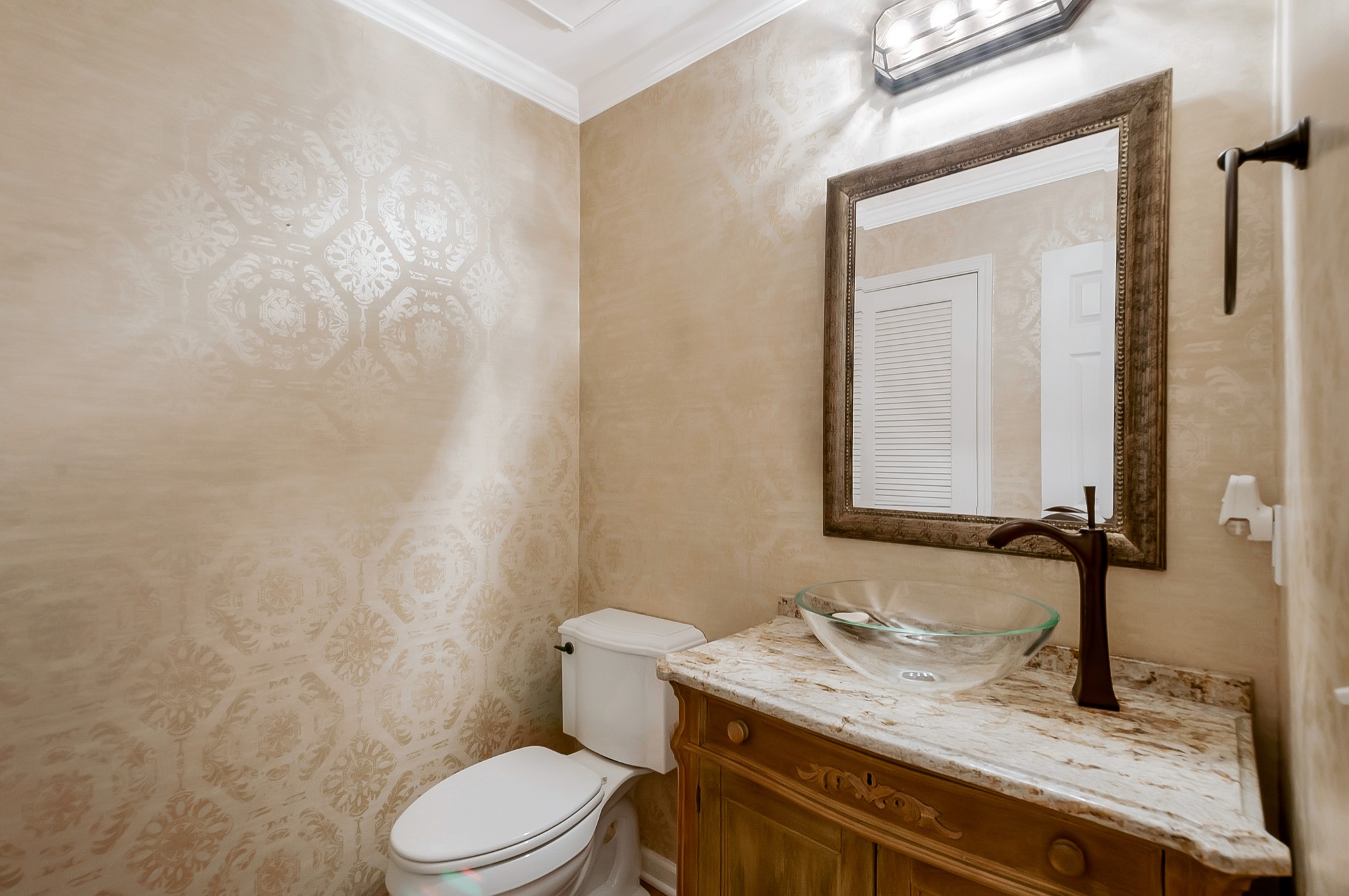 1078 General George Patton Road Nashville, TN 37221 - Photo 19 of 33 a bathroom with a granite countertop sink toilet and mirror