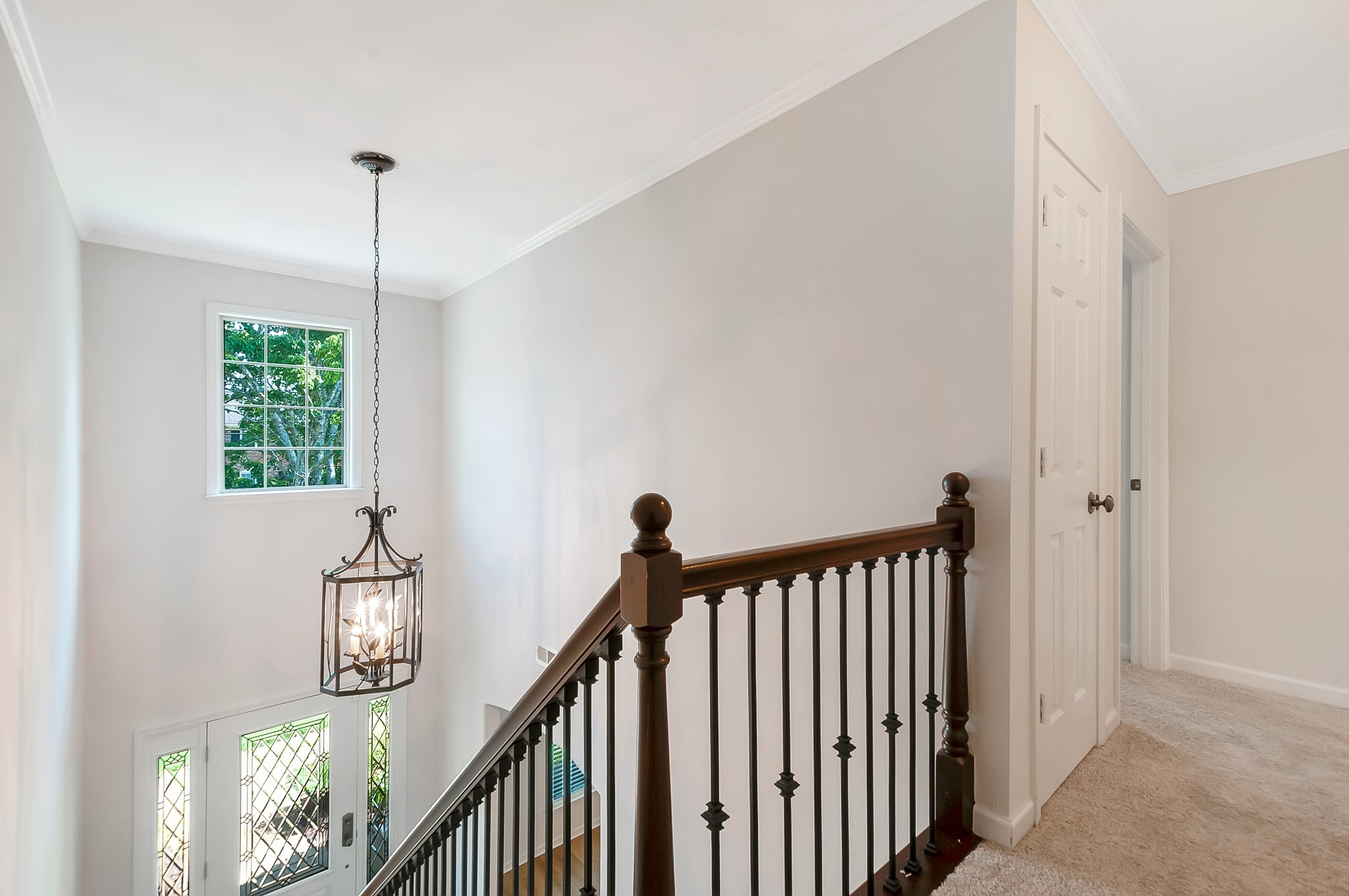 1078 General George Patton Road Nashville, TN 37221 - Photo 20 of 33 a view of a hallway with windows and stairs