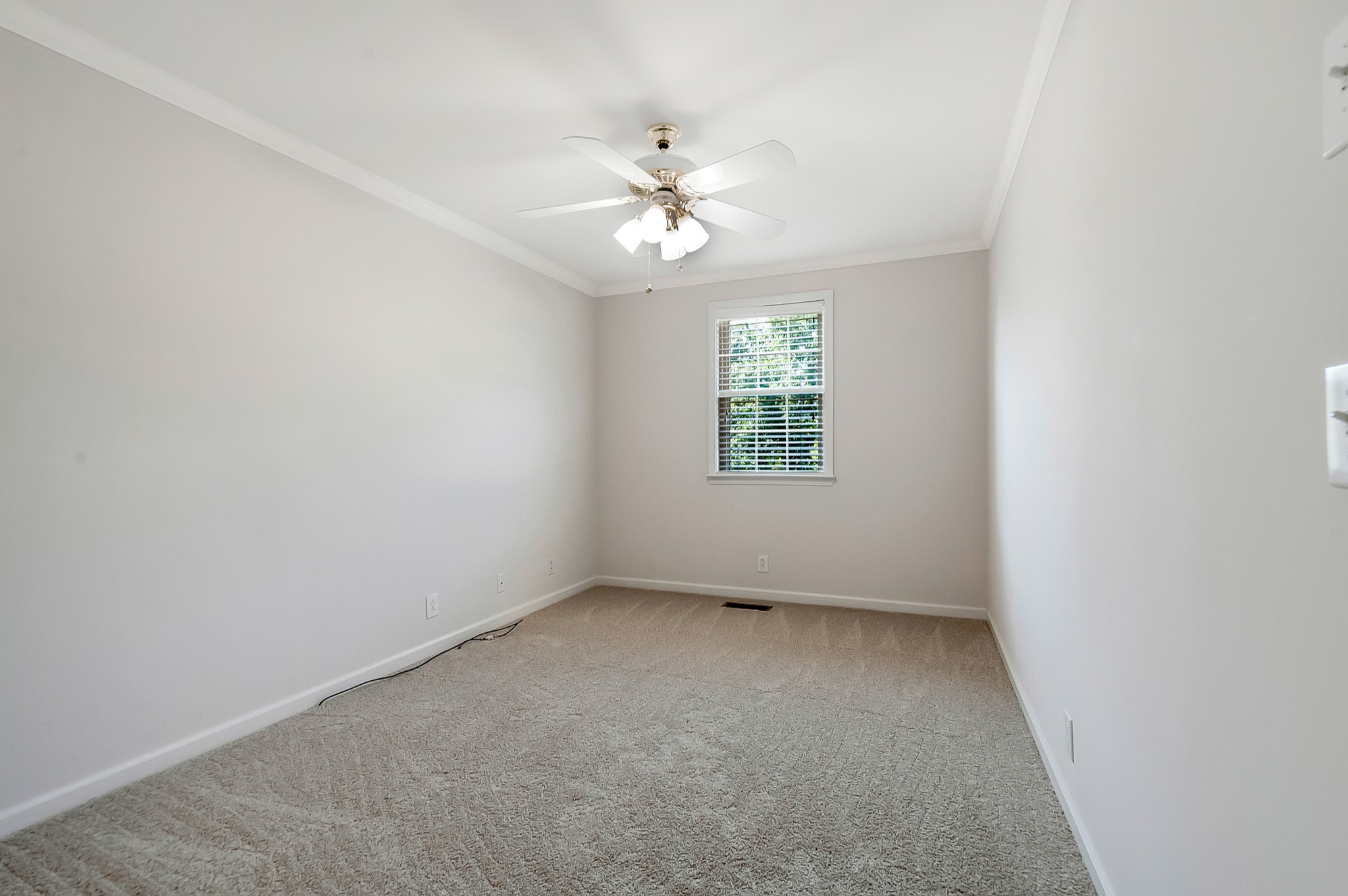 1078 General George Patton Road Nashville, TN 37221 - Photo 28 of 33 an empty room with a window and a fan
