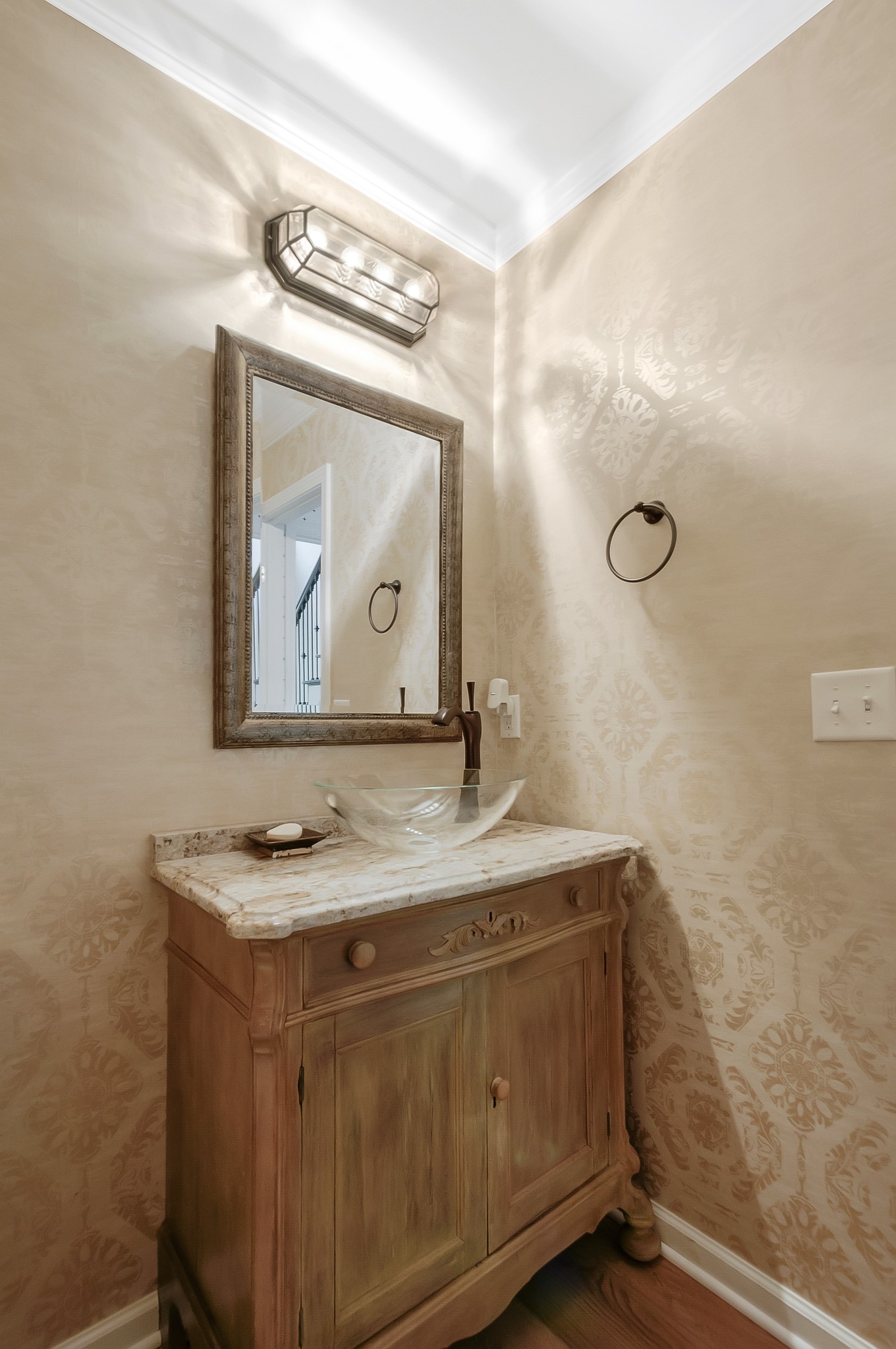 1078 General George Patton Road Nashville, TN 37221 - Photo 29 of 33 a bathroom with a granite countertop sink a mirror and vanity