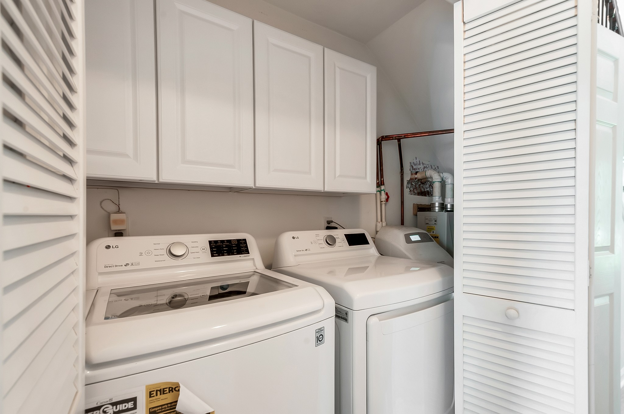 1078 General George Patton Road Nashville, TN 37221 - Photo 30 of 33 a view of washer and dryer with bathroom in the background