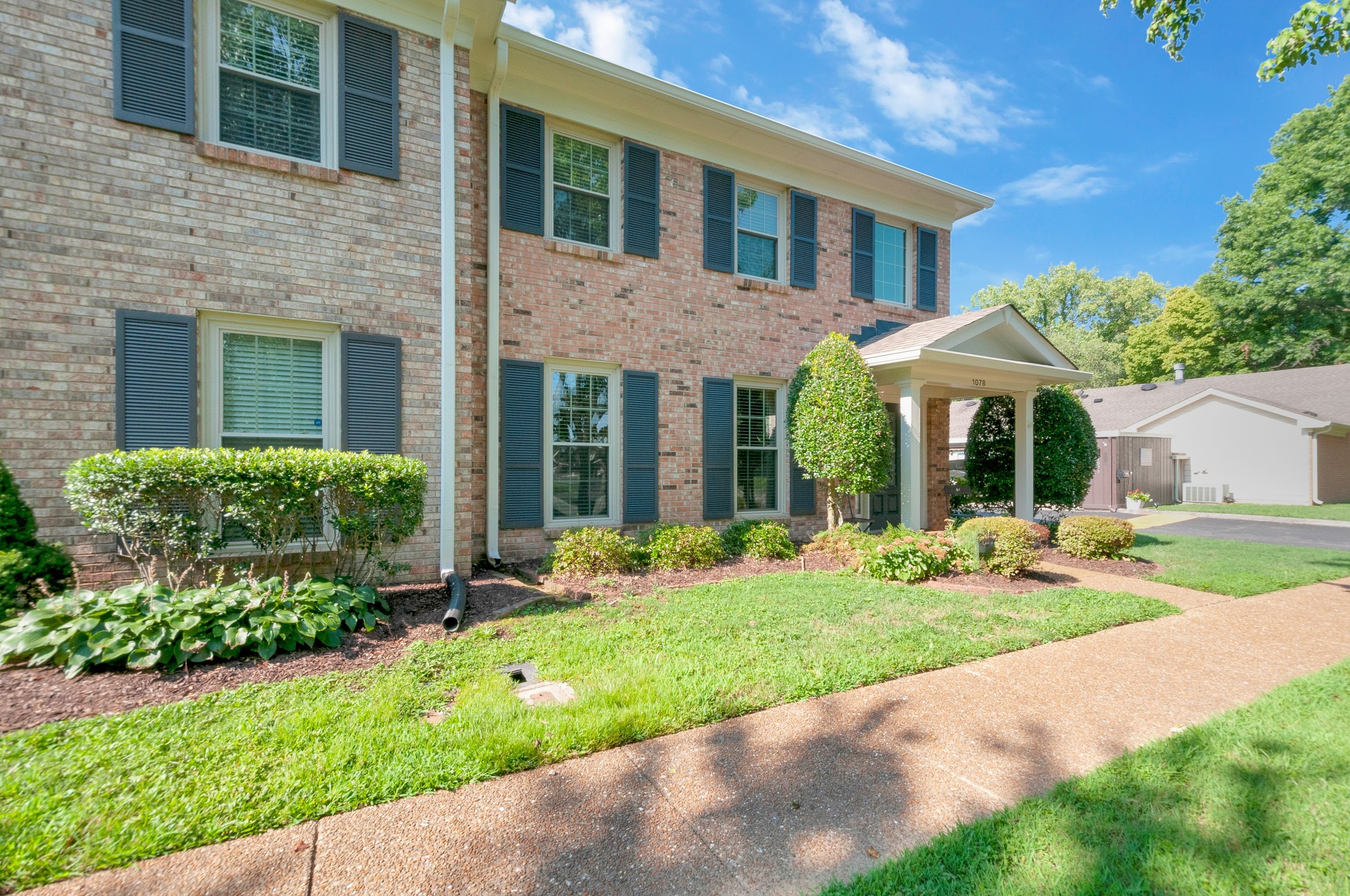 1078 General George Patton Road Nashville, TN 37221 - Photo 3 of 33 a view of a yard in front of a brick house
