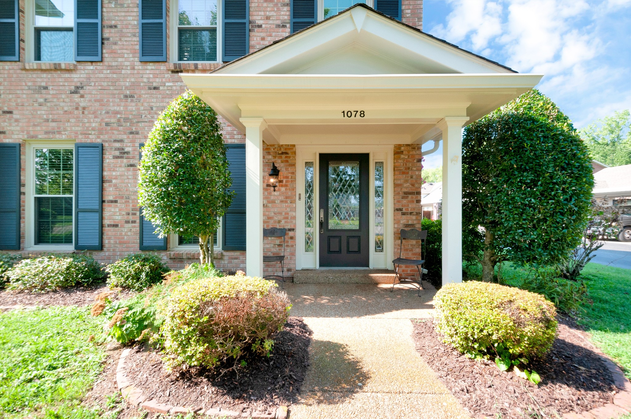 1078 General George Patton Road Nashville, TN 37221 - Photo 4 of 33 a front view of a house with a yard