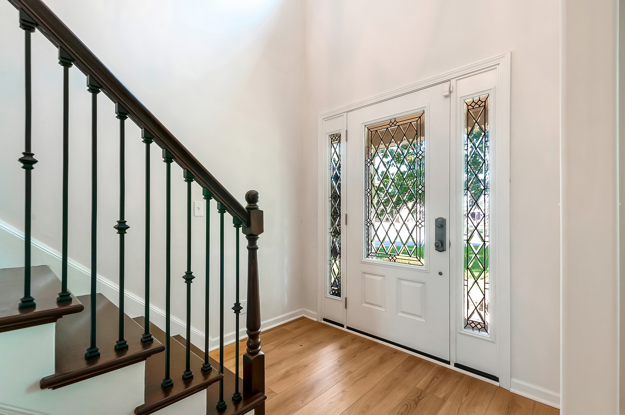 1078 General George Patton Road Nashville, TN 37221 - Photo 5 of 33 a view of an entryway with wooden floor and door