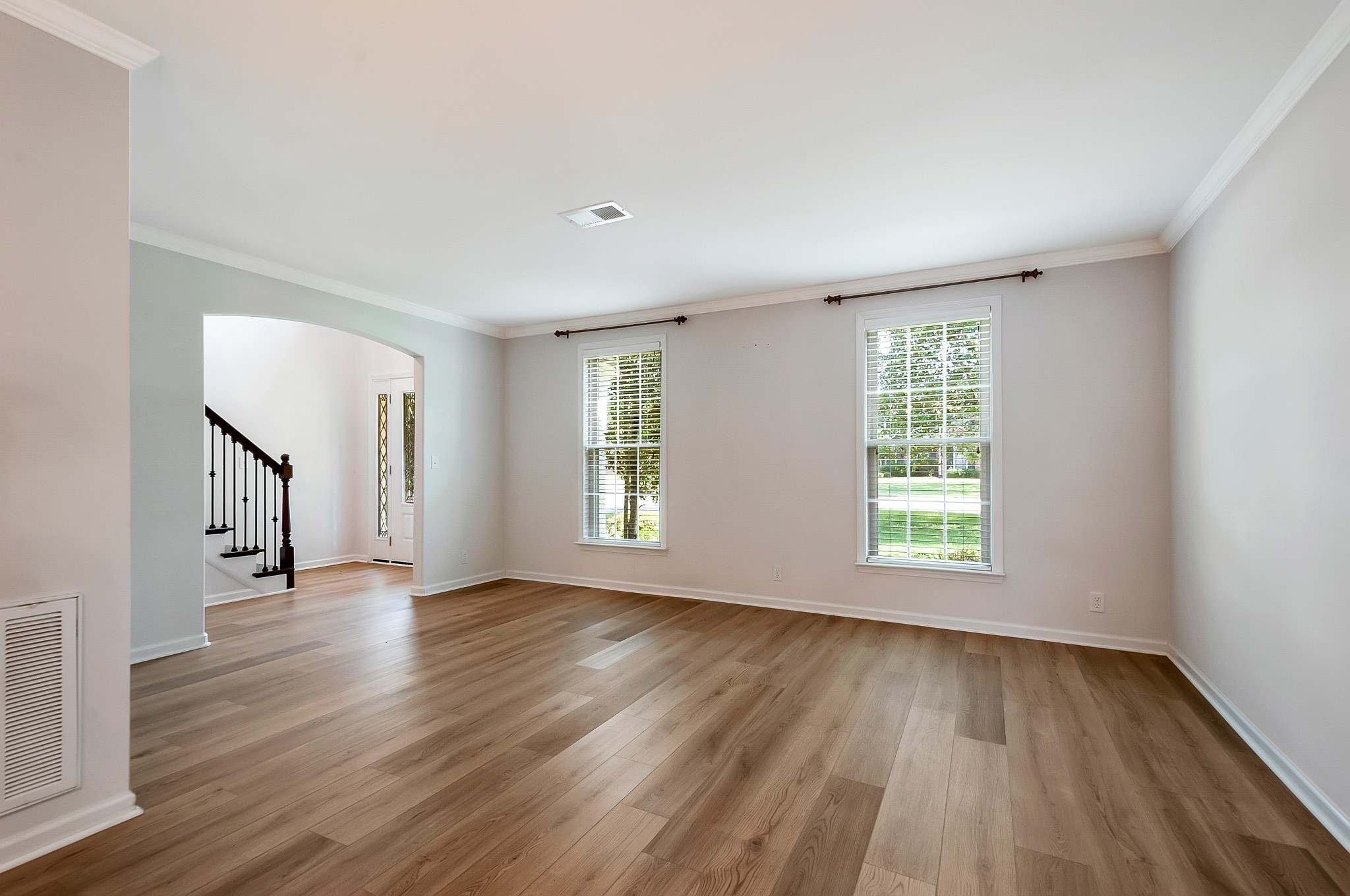1078 General George Patton Road Nashville, TN 37221 - Photo 7 of 33 an empty room with wooden floor and windows
