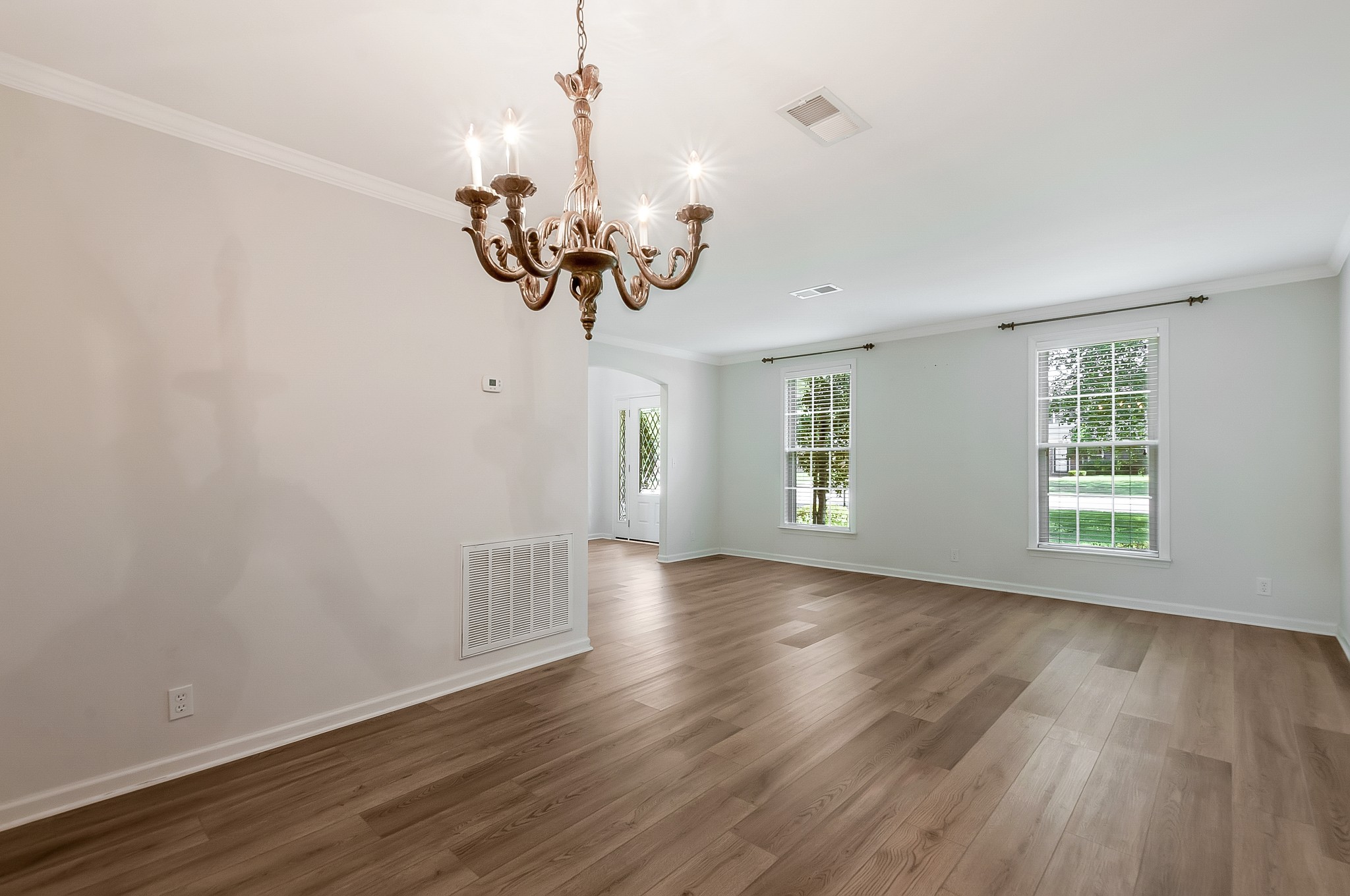 1078 General George Patton Road Nashville, TN 37221 - Photo 8 of 33 a view of an empty room with wooden floor and a window