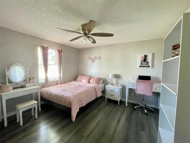 a bedroom with a bed and a table in it