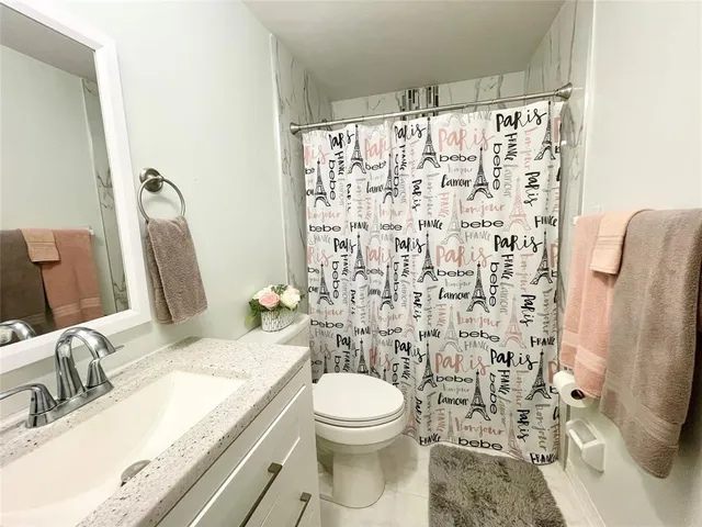 a bedroom with a bed and a desk