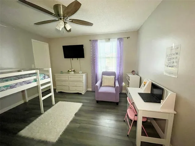 a room with a couch and a flat screen tv