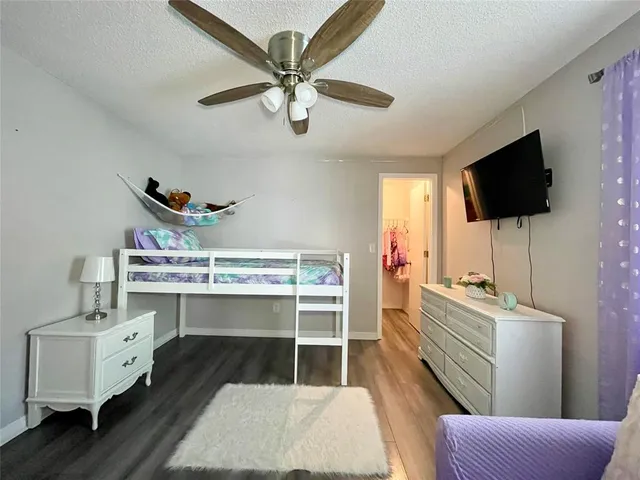 a view of a dining room with furniture and a chandelier