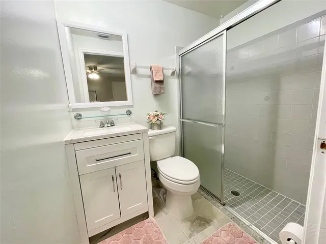 a bedroom with a bed and a table in it