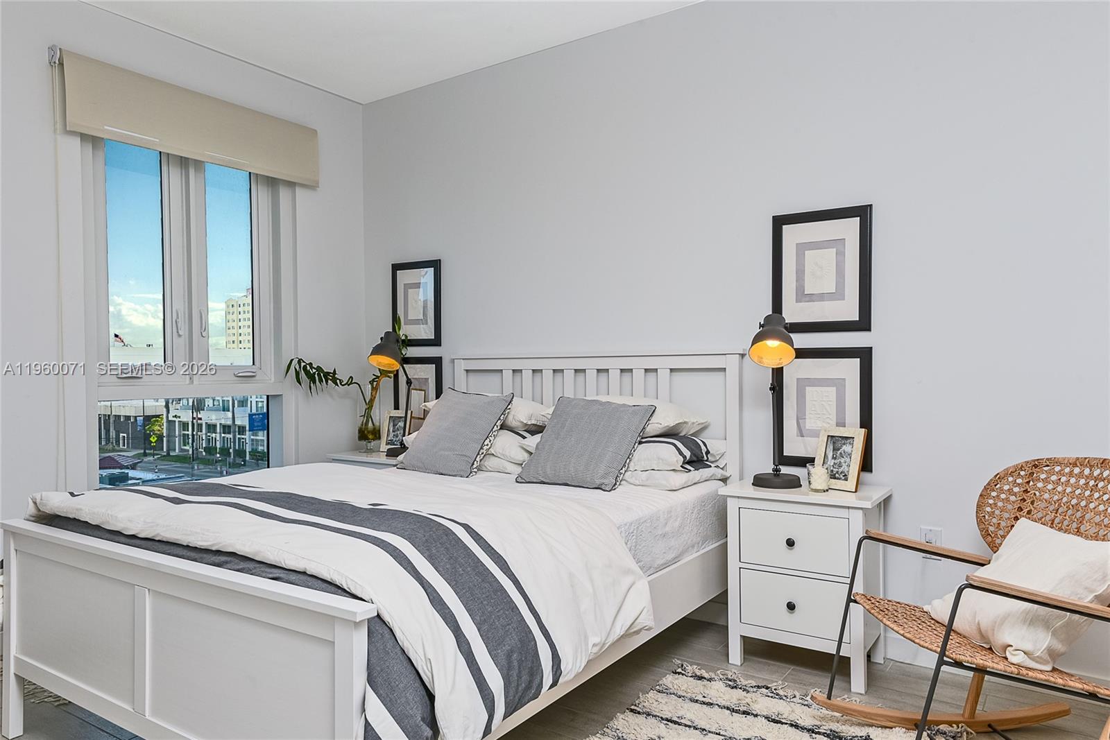 321 Northeast 26th Street, Unit 805 Miami, FL 33137 - Photo 23 of 23 a bedroom with a bed and wooden floor