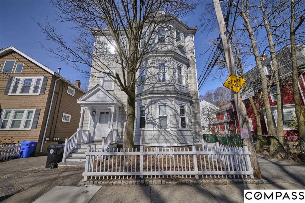 179 High Street, Unit 2 Brookline, MA 02445 - Photo 1 of 1 a view of a brick house with large windows