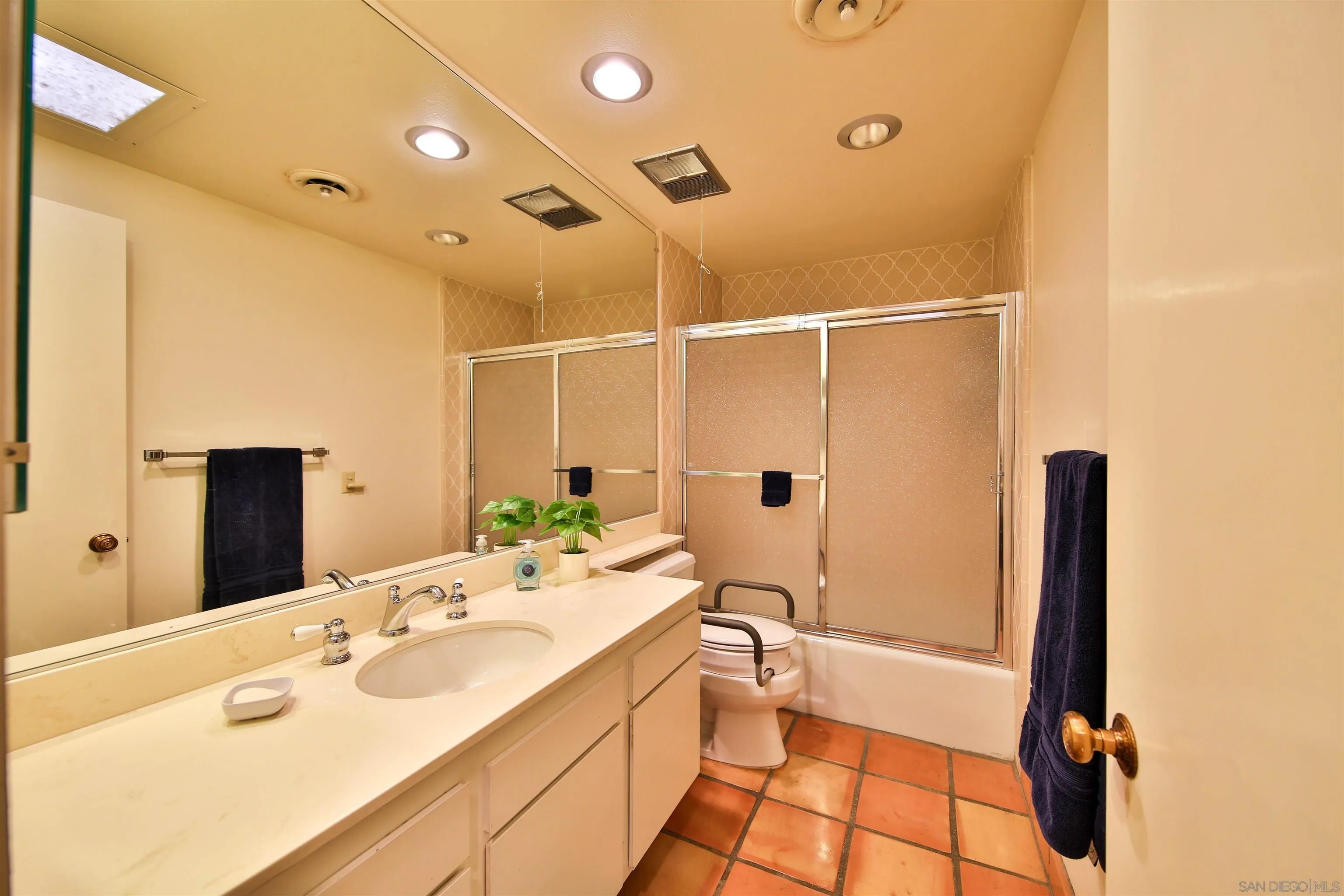 1682 Montezuma Court, Unit 13 Borrego Springs, CA 92004 - Photo 11 of 22 a bathroom with a sink and mirror with toilet