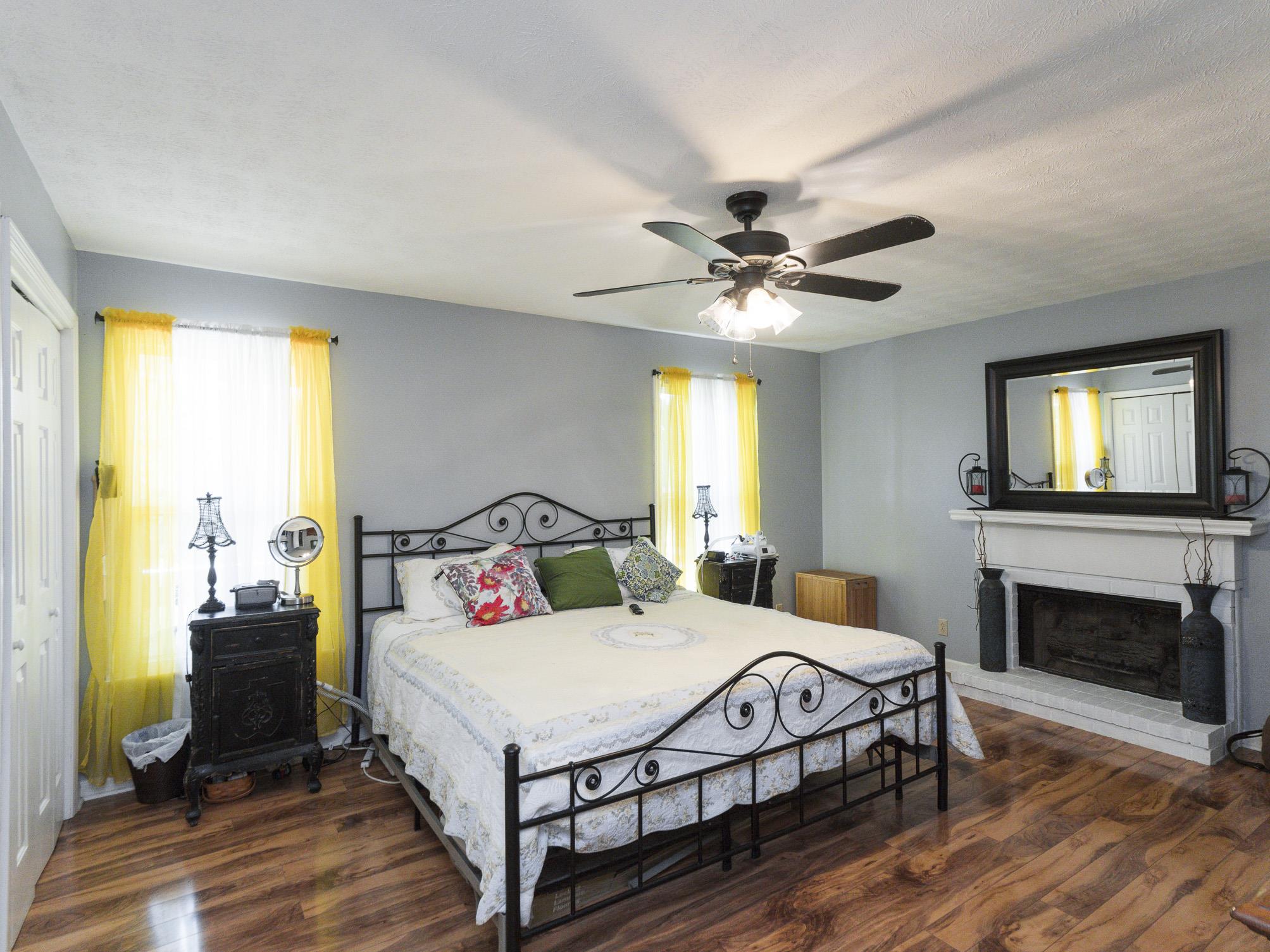 3609 Raymond Head Road Springfield, TN 37172 - Photo 11 of 30 a bedroom with a bed and a fireplace