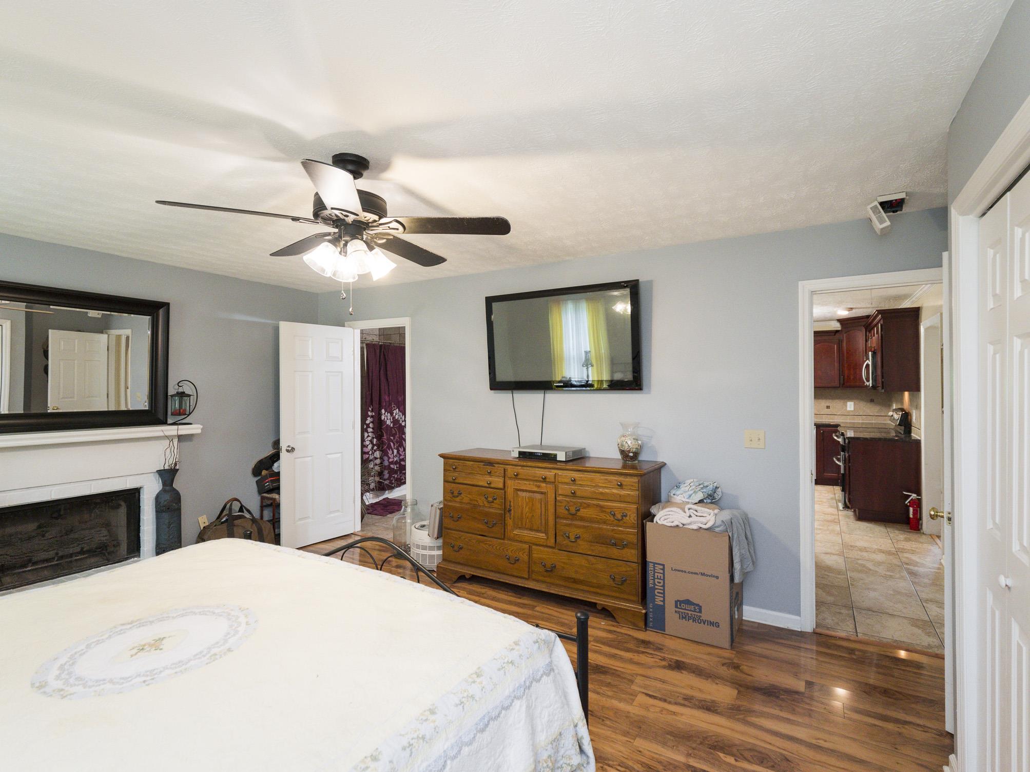 3609 Raymond Head Road Springfield, TN 37172 - Photo 12 of 30 a bedroom with a bed and a flat screen tv