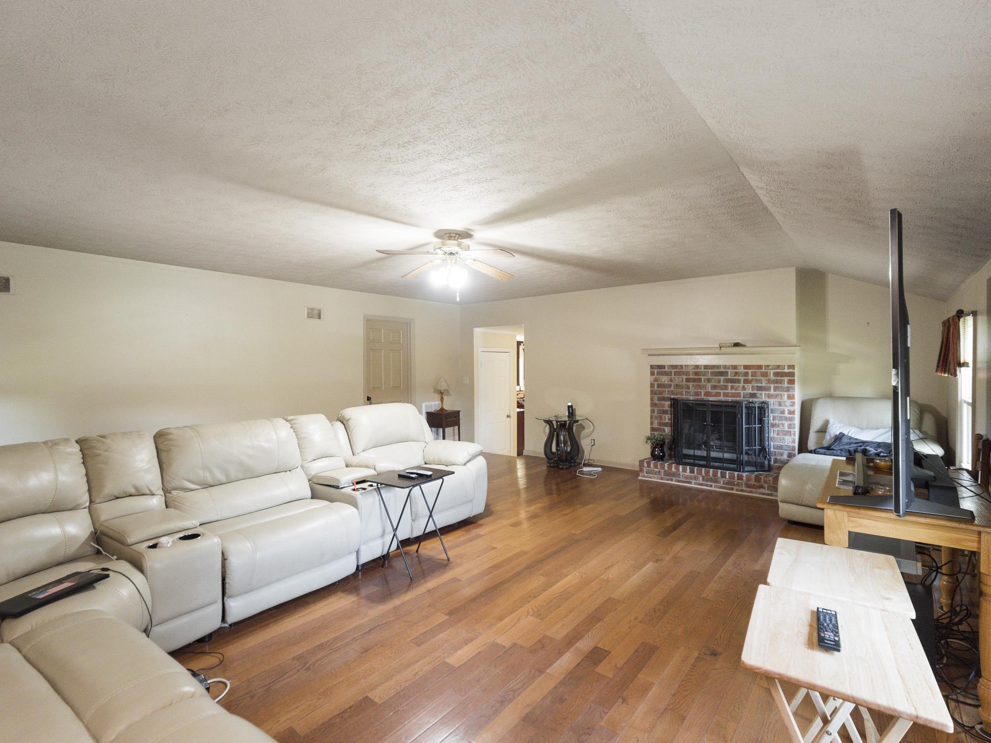 3609 Raymond Head Road Springfield, TN 37172 - Photo 15 of 30 a living room with furniture and a fireplace