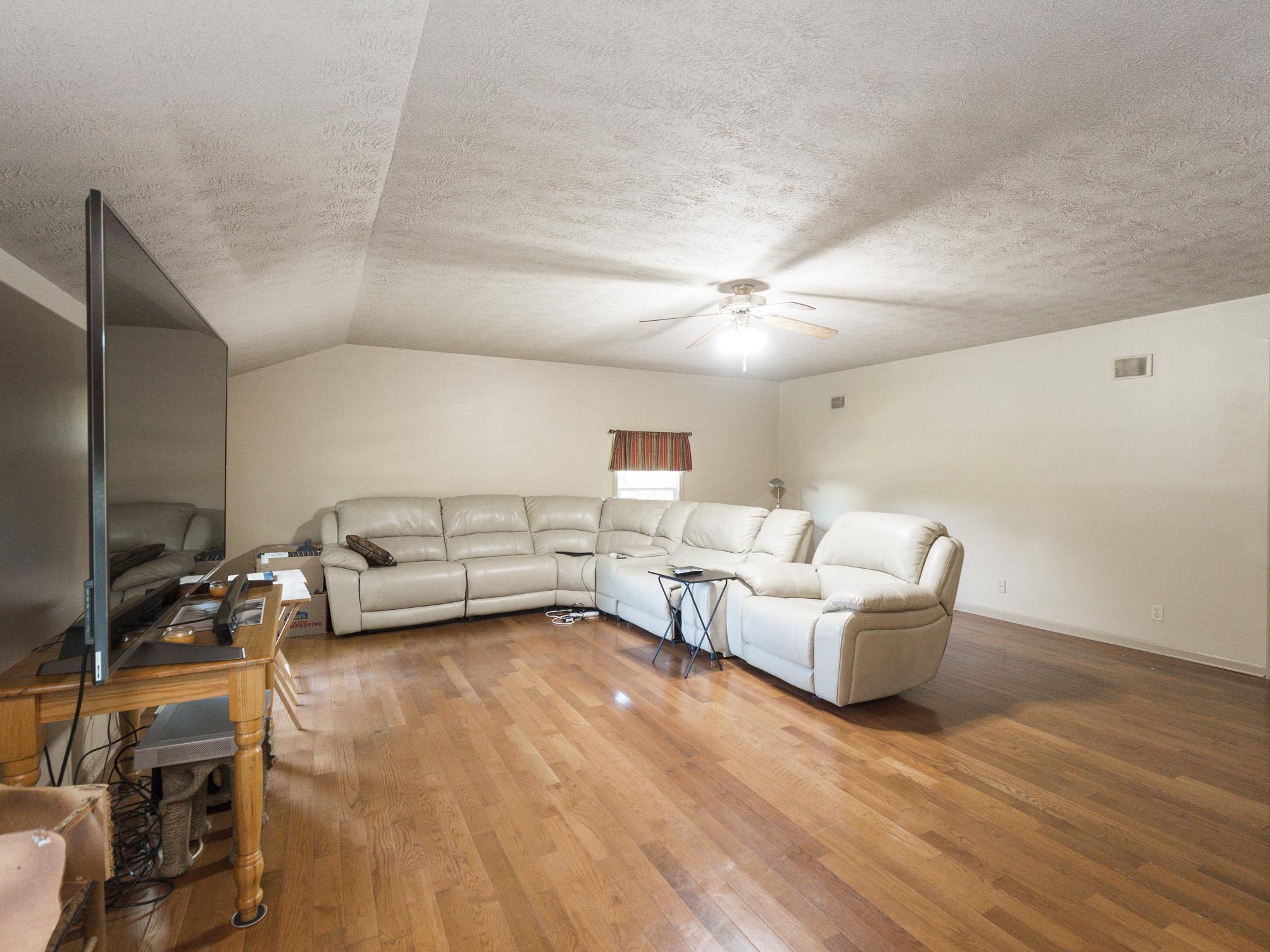 3609 Raymond Head Road Springfield, TN 37172 - Photo 16 of 30 a living room with furniture and a wooden floor