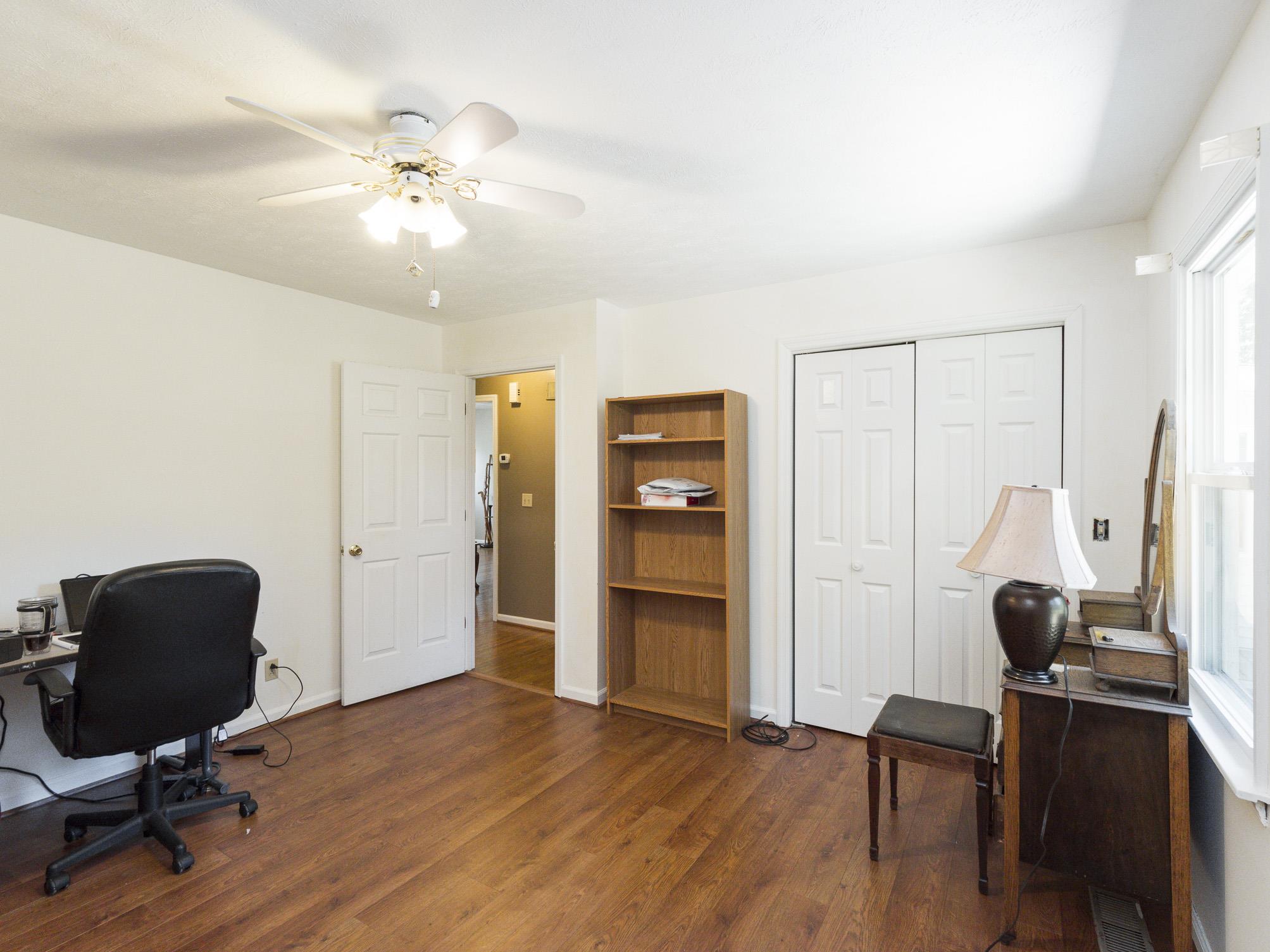 3609 Raymond Head Road Springfield, TN 37172 - Photo 19 of 30 a view of a workspace with furniture and wooden floor
