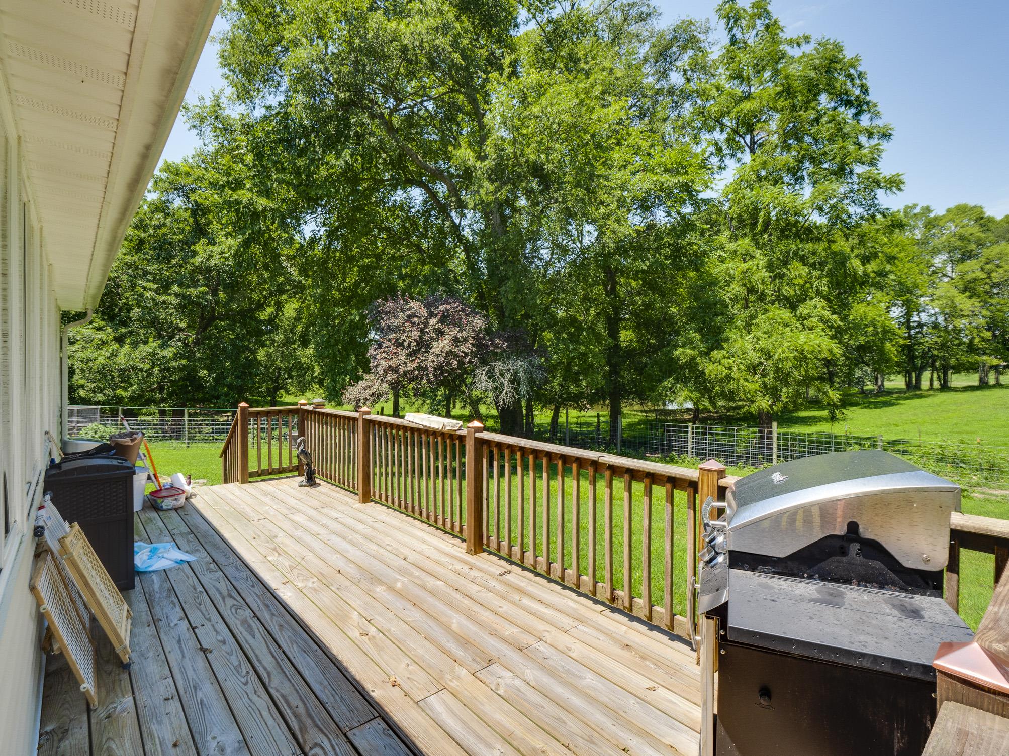 3609 Raymond Head Road Springfield, TN 37172 - Photo 26 of 30 a view of a deck with two chairs and a table