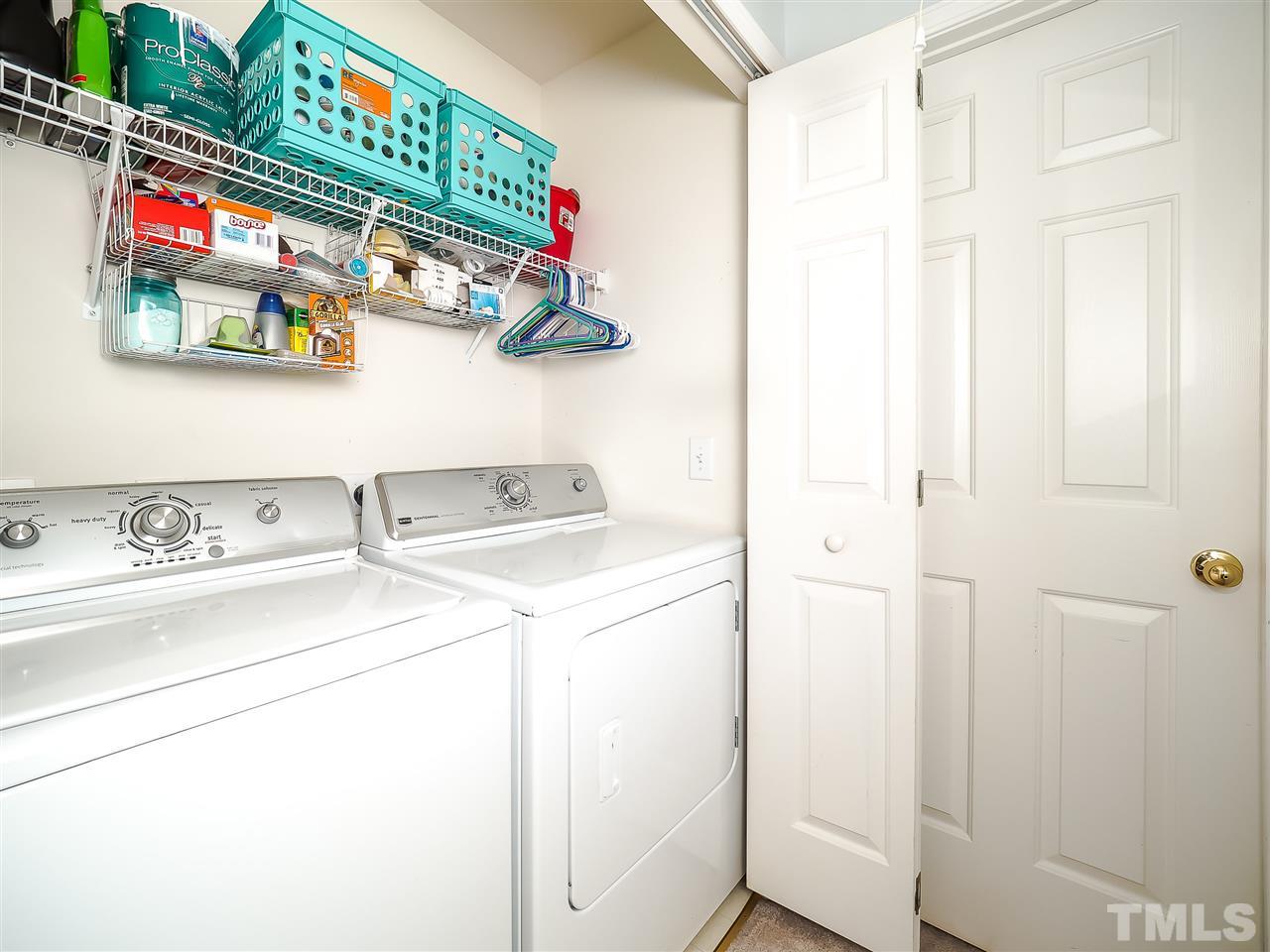 1715 Grace Brook Road Raleigh, NC 27609 - Photo 17 of 20 a utility room with dryer and washer