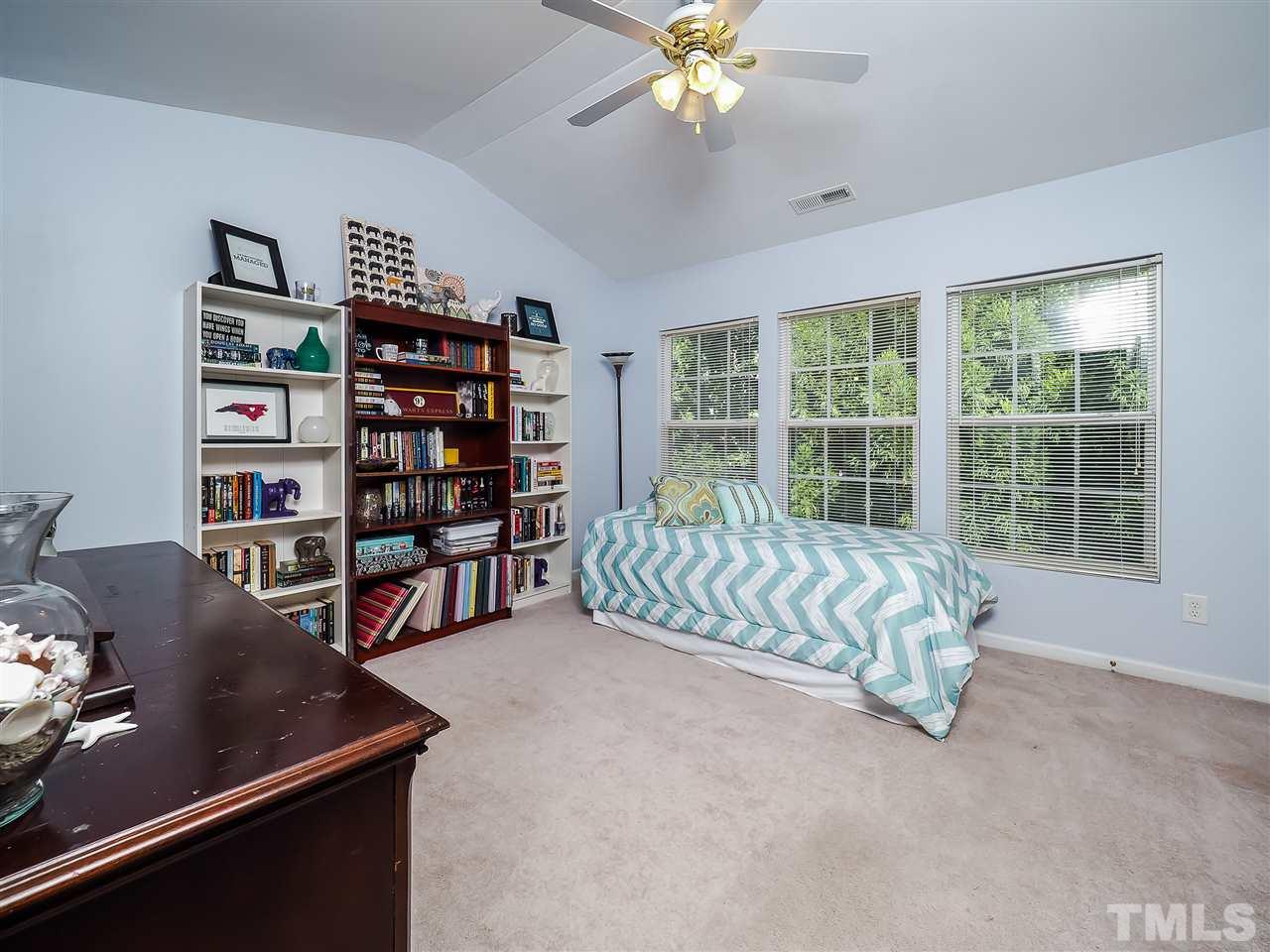 1715 Grace Brook Road Raleigh, NC 27609 - Photo 18 of 20 a living room with furniture and a large window