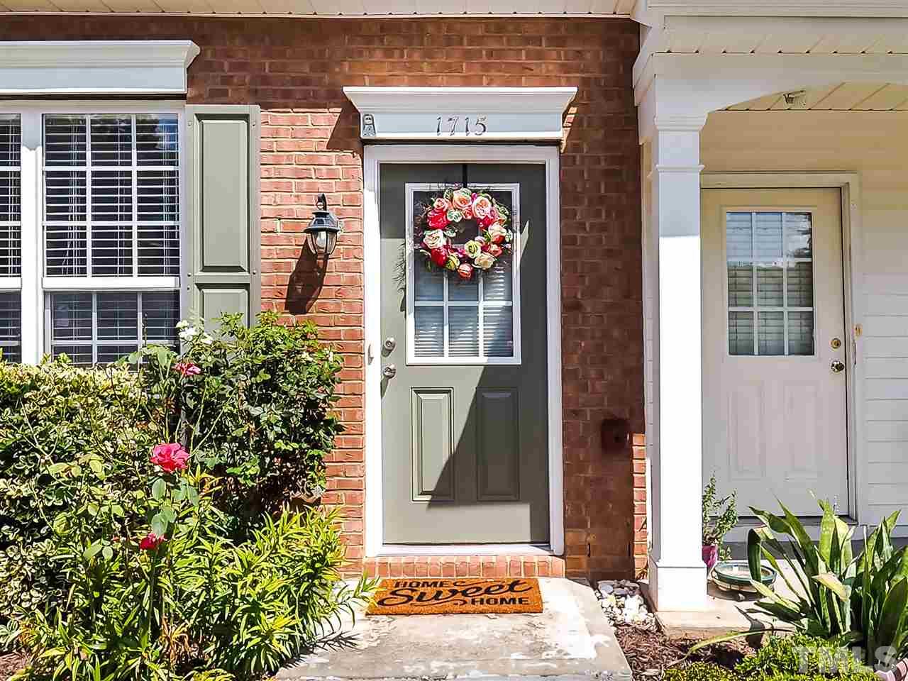 1715 Grace Brook Road Raleigh, NC 27609 - Photo 4 of 20 front view of a house with a potted plant