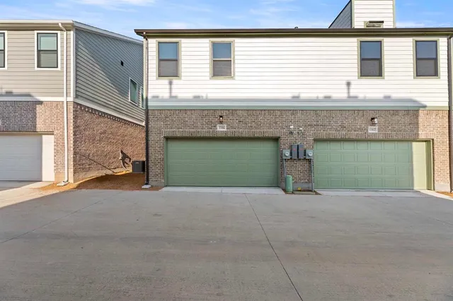 a view of a house with a garage and a window