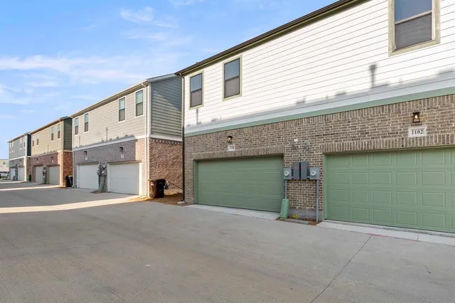 a view of a building with a garage