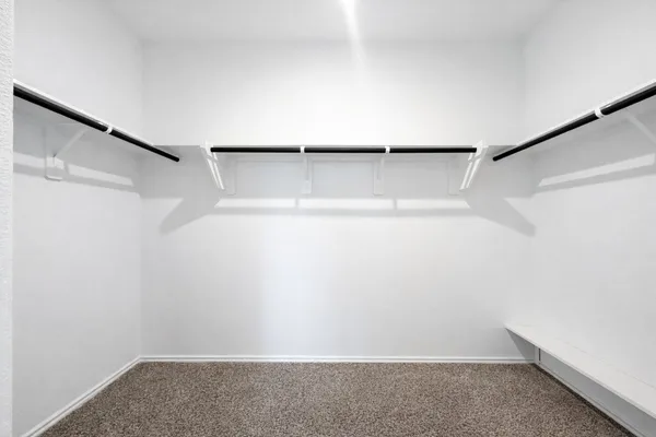 a view of an empty walk in closet