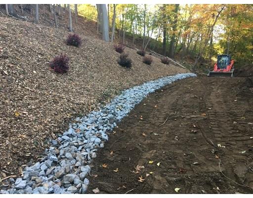 46 Berwick Road Attleboro, MA 02703 - Photo 6 of 6 a view of a dry yard with trees and stairs