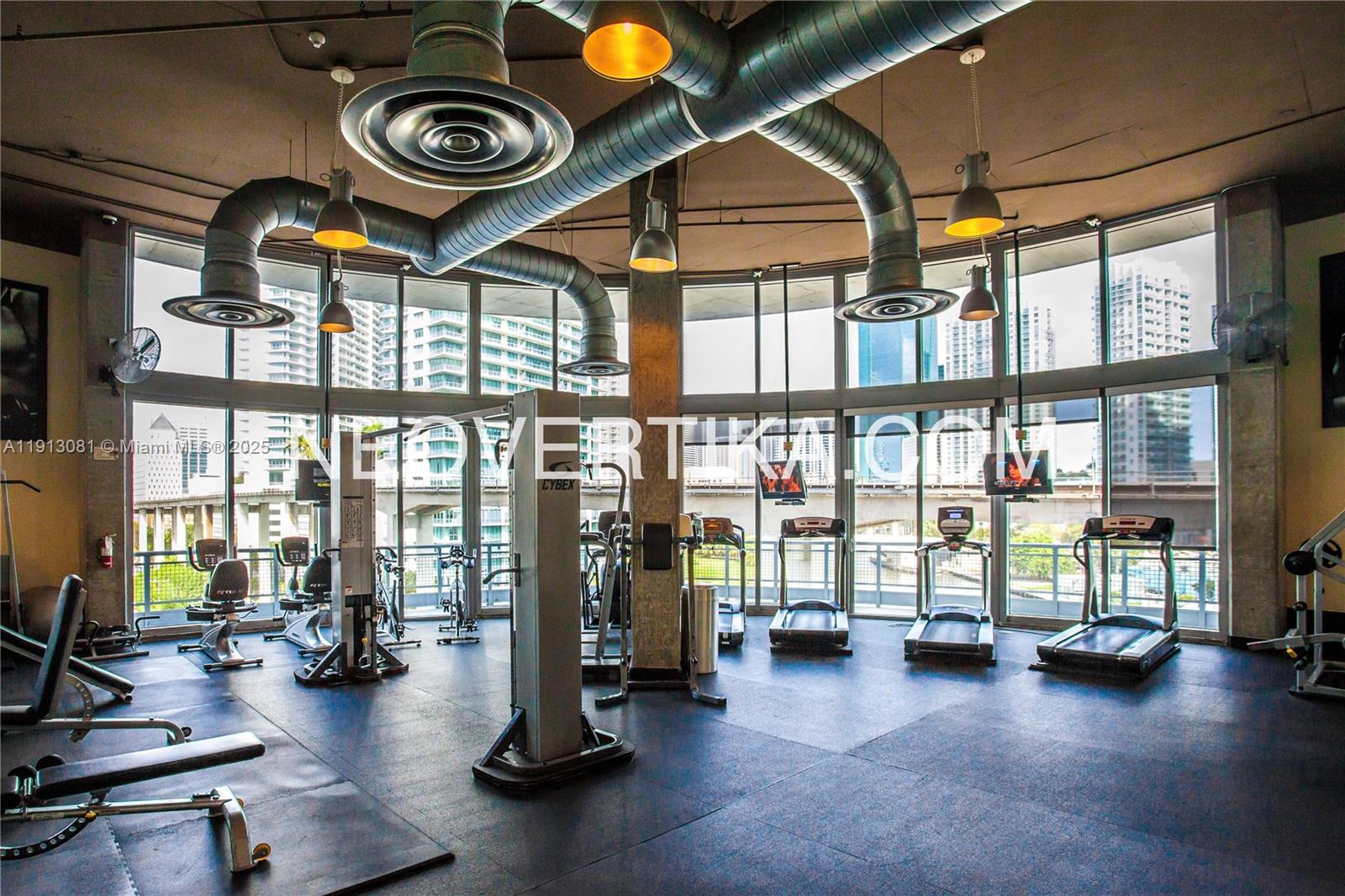 690 Southwest 1st Court, Unit PHI20 Miami, FL 33130 - Photo 12 of 21 a view of a room with gym equipment