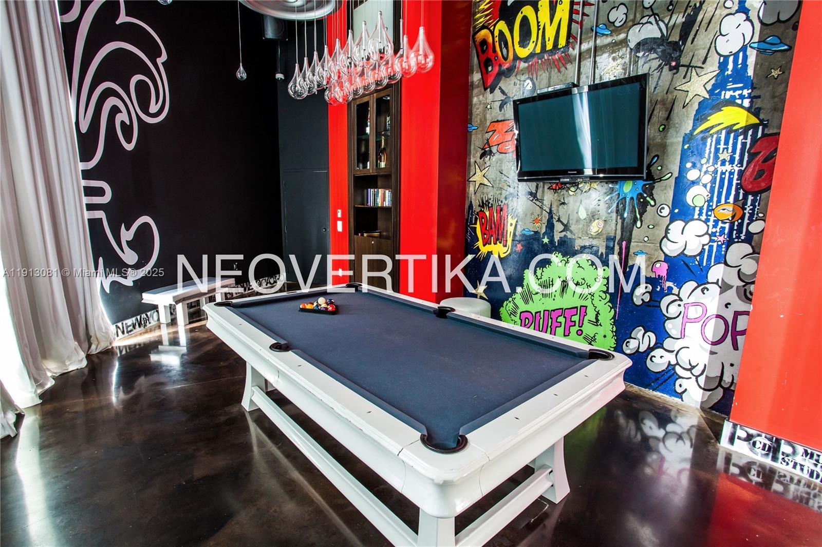 690 Southwest 1st Court, Unit PHI20 Miami, FL 33130 - Photo 14 of 21 a living room with furniture and a flat screen tv