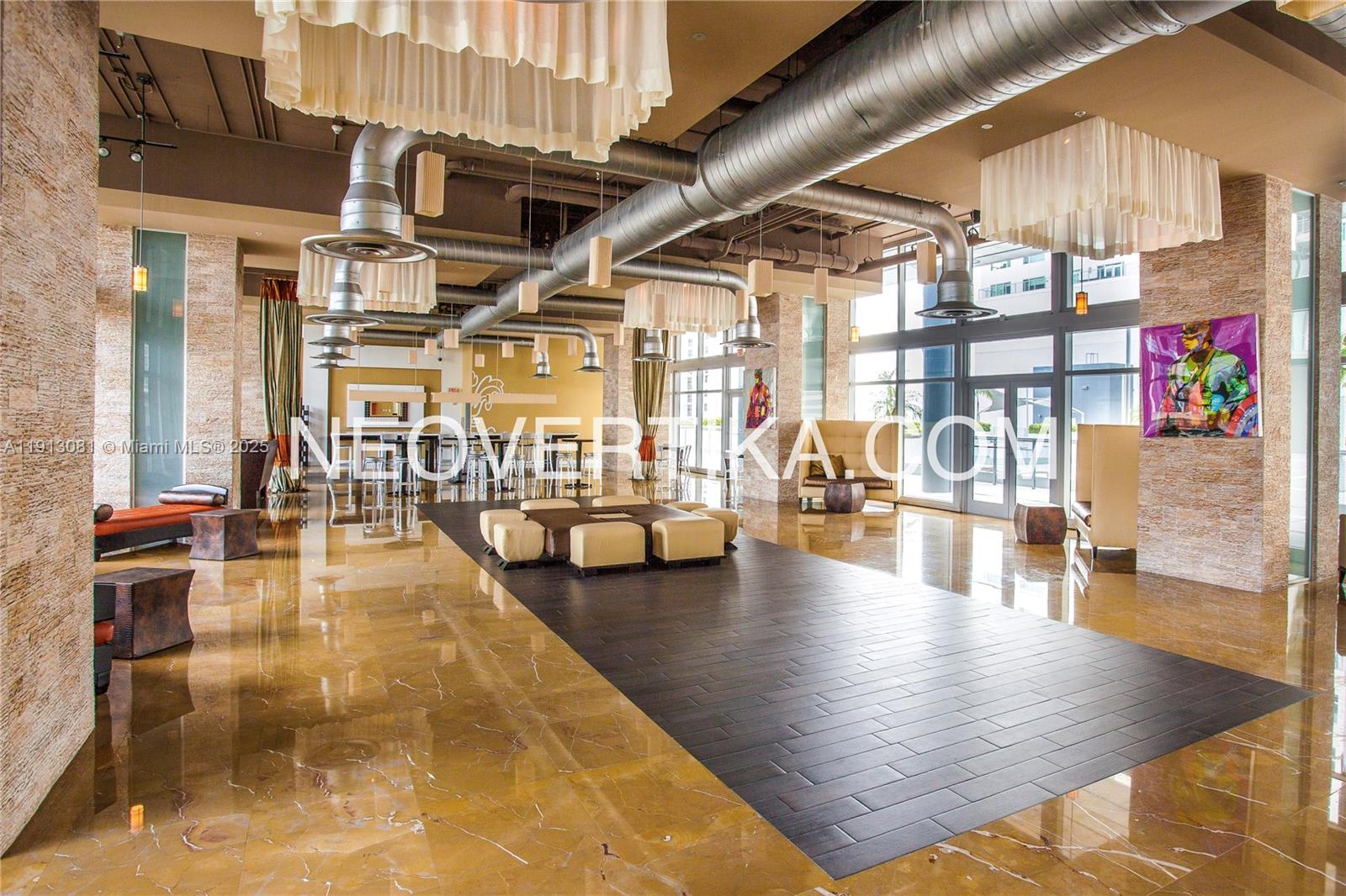 690 Southwest 1st Court, Unit PHI20 Miami, FL 33130 - Photo 15 of 21 a swimming pool with outdoor seating and yard