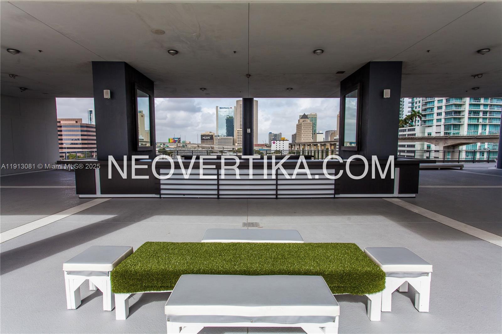 690 Southwest 1st Court, Unit PHI20 Miami, FL 33130 - Photo 20 of 21 a living room with a bed furniture and windows