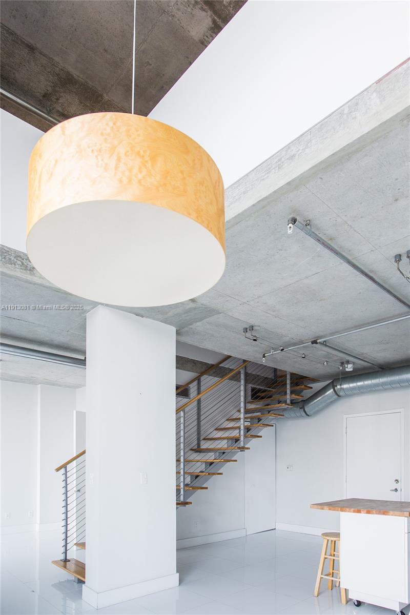 690 Southwest 1st Court, Unit PHI20 Miami, FL 33130 - Photo 2 of 21 a view of a room with gym equipment