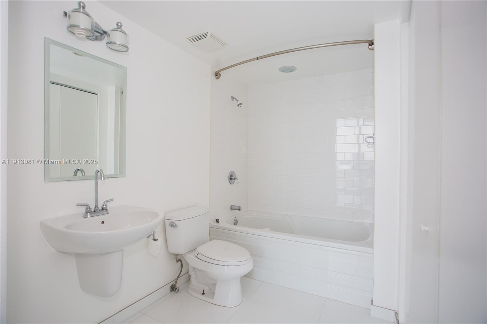 690 Southwest 1st Court, Unit PHI20 Miami, FL 33130 - Photo 9 of 21 a bathroom with a toilet a sink and a bathtub